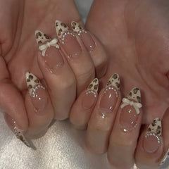 24Pcs Almond French Press on Fake Nails with Pearl Bow Design Wearable Leopard Print Pattern Nail Art Tips Long False Nails Set