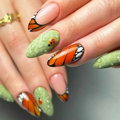 24Pcs Mid-length Blue Almond False Nails with 3D Shell Design Press on Nails Tips Butterfly Flower Pattern Datachable Fake Nail